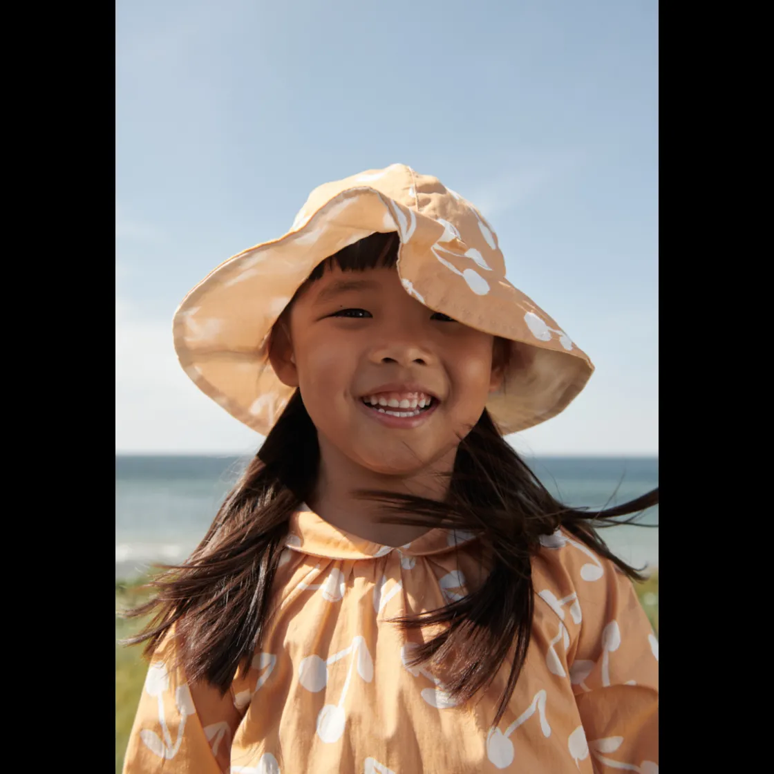 Liewood Amelia Wendbarer Sonnenhut Cherry blossom / Light apricot Hot